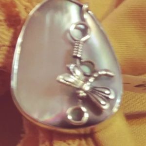 NATURE'S, UNIQUELY BEAUTIFUL, MOTHER OF PEARL AND STERLING SILVER . SIZE 6